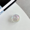 Macro shot of iridescent resin phone grip featuring a crystal-embedded cherry design - Crystal Ball Grip - Dreamy Bubble - No. 83