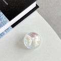 Detail view of a dreamy iridescent phone grip with a pearlescent white resin bow decor - Crystal Ball Grip - Dreamy Bubble - No. 72