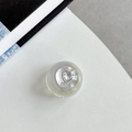 Macro detail of iridescent heart phone grip with sparkling crystal and embossed MIU logo - Crystal Ball Grip - Dreamy Bubble - No. 73