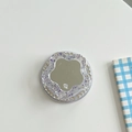 Macro detail of rhinestone phone socket with floral mirror and sparkling glitter finish - Magnetic Glitter Flower Mirror - Purple