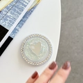 Macro detail of round phone grip with iridescent sequins, rhinestones, and heart mirror - Magnetic Sequin Heart Mirror - Green