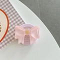 Dettaglio del supporto per telefono a fiocco 3D rosa con base magnetica - Rosa