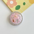 Detail van roze glitter telefoonhouder met zeester, schelpen en fonkelende steentjes - Witte Strass Magnetisch - Oceaan Zeester - Roze