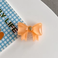 Detalle del soporte para móvil con lazo naranja y relieve de corazón dorado fino - Lazo Grande Corazón Francés Naranja
