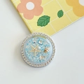 Close-up of ocean-themed phone grip with blue glitter, shells, and starfish details - White Rhinestone Magnetic - Ocean Starfish - Blue