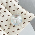 Close-up of holographic crystal ball phone grip with a 3D white ribbon bow inside - Crystal Ball Holder-Dreamy Bubble-No.59
