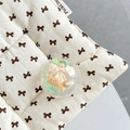 Macro view of cute crystal ball phone grip with brown bear and bow on quilted base - Crystal Ball Holder-Dreamy Bubble-No.64