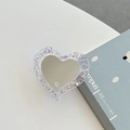 Détail du support MagSafe en forme de cœur avec paillettes violettes et miroir de maquillage - Support Transparent Miroir de Coeur à Paillettes (Violet)