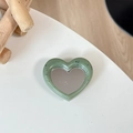 Macro detail of heart-shaped matcha green mirror phone grip with black splash patterns - Ink Green (Splatter Heart Mirror)