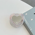 Dettaglio macro del supporto MagSafe a cuore per telefono con glitter e specchio - Specchio a Cuore Magnetico Glitterato (Rosso-Zirconia Bianco)