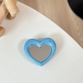 Detail of blue ink-splattered heart mirror phone stand on a minimalist white desk - Light Blue (Splatter Heart Mirror)