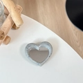 Detail of heart-shaped phone grip mirror with grey terrazzo pattern on a white desk - Grey (Splatter Heart Mirror)