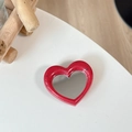 Detail of red heart-shaped phone grip with built-in mirror and matte speckled frame - Rose Red (Splatter Heart Mirror)
