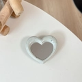 Macro view of heart-shaped mirror phone grip with cream-colored spotted resin frame - Cream White (Splatter Heart Mirror)