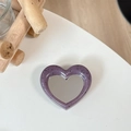 Close-up of heart-shaped phone grip with purple speckled frame and makeup mirror - Morandi Purple (Splatter Heart Mirror)