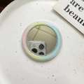 Detail view of MagSafe mirror phone grip with rainbow gradient edges on ceramic tray - Gradient Blue