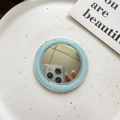 Detail of light blue MagSafe mirror accessory on a white tray with aesthetic card - Blue