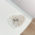 Detail of heart-shaped phone grip with marble pattern and silver rhinestone bow - Transparent Stand Shell Heart Hollow Knot