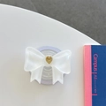 Dettaglio ravvicinato del supporto per telefono a fiocco con cuore dorato centrale - Grande Fiocco Magnetico Cuore Francese / Bianco