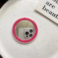 Detail of round MagSafe phone mirror base with pink frame showing real reflection - Rose Red