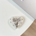 Macro view of rhinestone heart phone holder with silver bow on magnetic surface - Transparent Stand Shell Heart Dear Small Butterfly