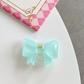 Detail of mint green bow phone grip with gold accent and transparent expandable base - Dark Green