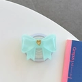 Dettaglio del supporto per telefono a fiocco verde menta con cuore dorato centrale - Grande Fiocco Magnetico Cuore Francese / verde scuro