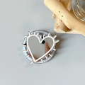 Macro view of heart-shaped silver mirror phone grip with white thorn line art - Magnetic Hedgehog Heart Mirror / Light Pink