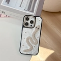 Detalle de textura de piel de serpiente y motivo de serpiente de strass en funda iPhone - Blanco / iPhone 17 Pro Max