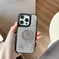 Close-up of luxury leather iPhone case with rhinestone dollar signs and metal ring detail - Pearlescent Silver