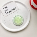 Detailed top view of a round magnetic MagSafe phone grip with green shell texture inlay - Magnetic Model / Light Green