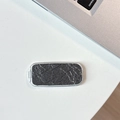 Close-up of snakeskin texture mirror phone stand with elegant gray marble finish - Pearlescent Texture / Gray