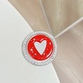 Close-up of red glitter phone grip with white heart motif and rhinestone border - Red