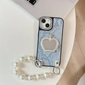Detail of blue snake texture phone case with heart mirror crown and pearl strap - Blue / iPhone XR