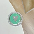 Macro shot of mint green glitter phone grip with silver heart and rhinestone border - Dark Green