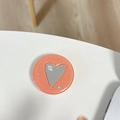 Dettaglio del supporto per telefono glitterato con specchio a cuore e scritta mine - Trasparente-Specchio Cuore Stellato-Arancione