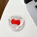 Dettaglio del supporto Magsafe a forma di cuore con fiocco rosso su biglietto regalo - Magnetico-Rosso