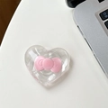 Close-up of heart-shaped magnetic phone grip with a 3D pink bow on a desk - Adhesive - Pink