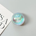 Detail eines runden Laser-Tulpen-Handyhalters mit blauem Glitzer auf grauem Grund - Traumhafte Seifenblase Nr. 1