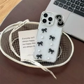 Detail of glitter iPhone case with black 3D bows, pearls and silver sequins decoration - Black (Starry Drip Glue Macaron Pearl Bow) / iPhone 17 Pro Max