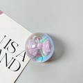 Detailed view of a holographic round phone grip with a 3D purple ribbon inside - Dreamy Bubble No. 8