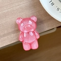 Close-up of a pink glitter bear phone grip with sparkling resin and glossy finish - Standard Pop Socket Style / Pearlescent Bear - Ankara Red