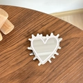 Detail of silver heart-shaped mirror phone grip with white wavy frame on wood background - Transparent Stand - Hedgehog Heart Mirror - Light Pink
