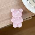 Close-up of pink glitter bear-shaped phone socket on a minimalist wooden table - Standard Pop Socket Style / Pearlescent Bear - Pink