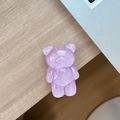 Close-up of a glittery purple resin bear phone grip on a minimalist wooden desktop - Standard Pop Socket Style / Pearlescent Bear - Purple