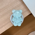 Close-up of a sparkling light blue bear phone grip with glitter and pearl bead trim - Magnetic Pearl Chain Style / Pearlescent Bear - Blue