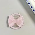 Dettaglio del supporto per telefono a fiocco glitterato rosa con bordo di perle - Stile Magnetico Perla / Rosa