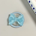 Detail of light blue glitter bow MagSafe phone socket with decorative faux pearl border - Pearl Magnetic Style / Blue