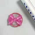Detailed view of pink glitter bow MagSafe phone socket with red beads and transparent base - Pearl Magnetic Style / Rose Red