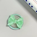 Macro detail of mint green bow phone grip with glitter finish and pearl trim - Pearl Magnetic Style / Dark Green